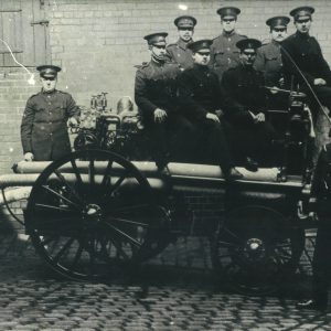 Firemen and Steam Fire Engine in Cobbled Yard