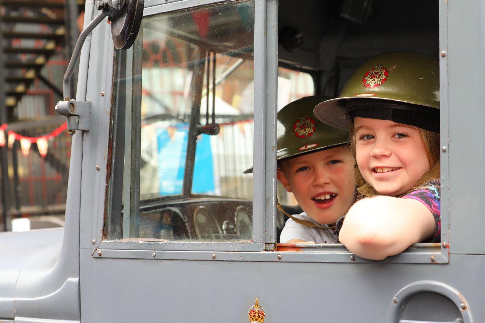 Children in Wartime Fire Helmets at the National Emergency Services Museum Children in Wartime Fire Helmets at the National Emergency Services Museum